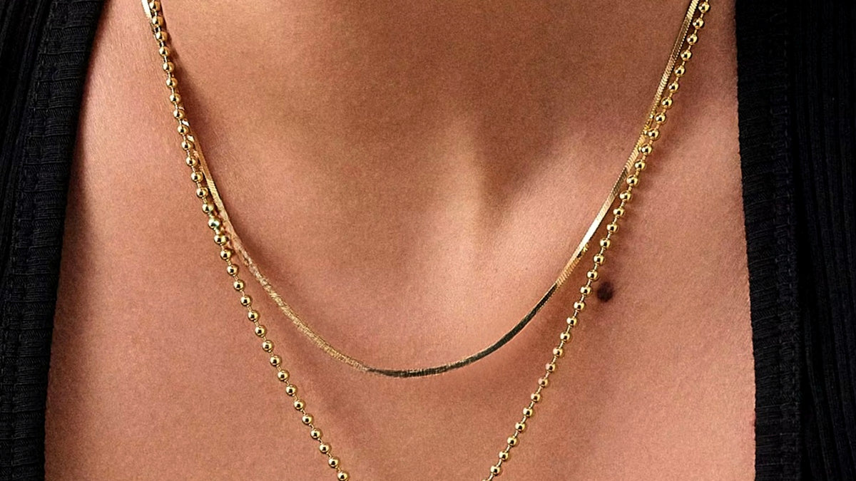ETCH hero, layered gold chains