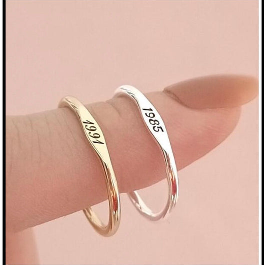 RECORD RING, engraved gold and silver bands
